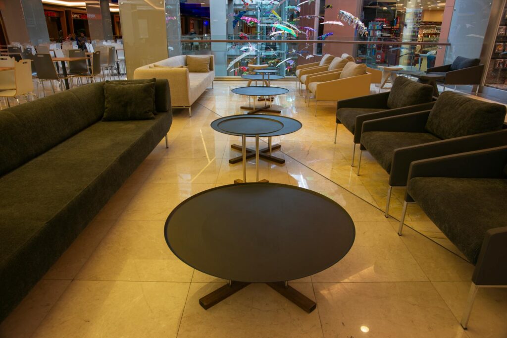 round black table near brown couch